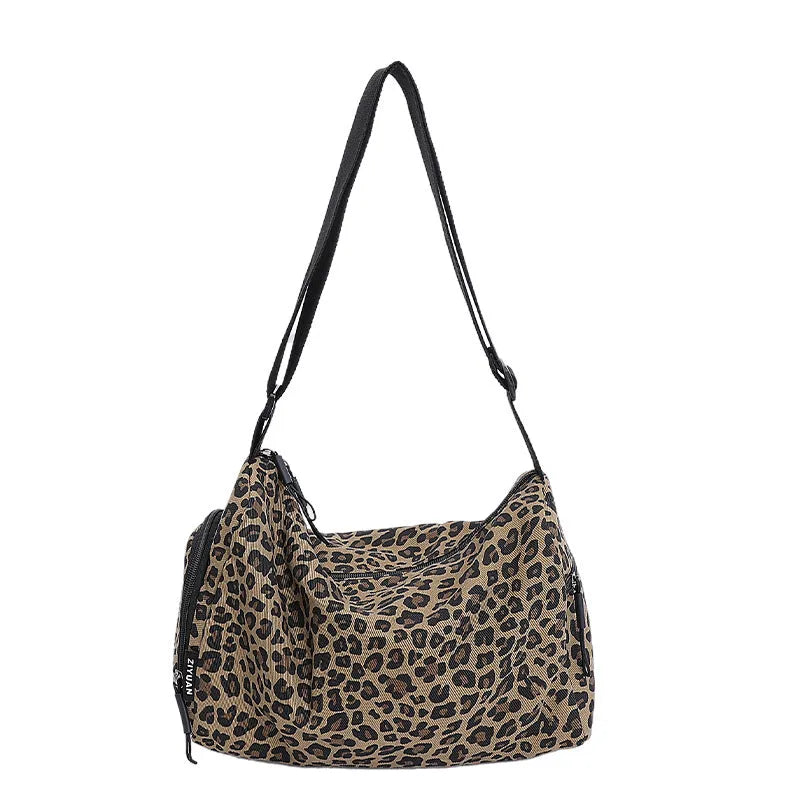 Leopard print sports style cross-body messenger bag with large capacity and cloth construction