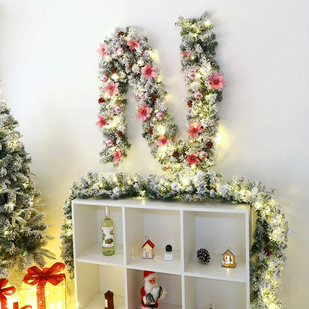 Flocked PVC rattan vine Christmas garland decoration in a festive colour, draped over a mantelpiece.