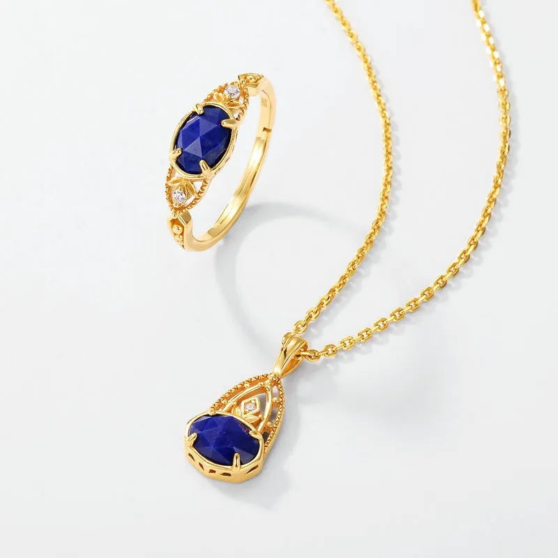 Japanese style geometric ellipse silver alloy ring for women in a lapis lazuli forest night sky colour.
