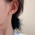 Women's fishtail design earrings in electroplated white gold or yellow gold colour on copper