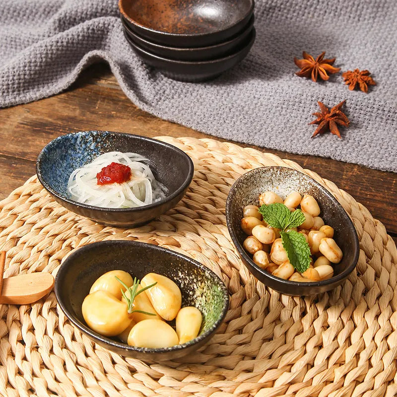 Japanese oval ceramic sauce dipping bowl with traditional underglaze pattern design