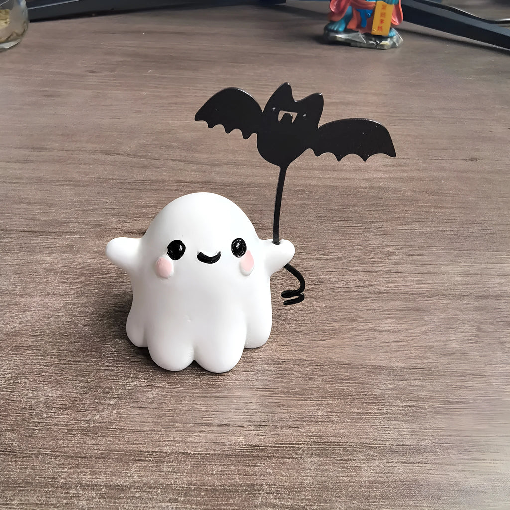 Mini resin figurine of a ghost walking a small dog, a 4x5x4cm Halloween decoration.