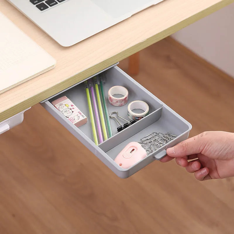 Plastic under-desk storage drawer with cover showing internal grid compartments