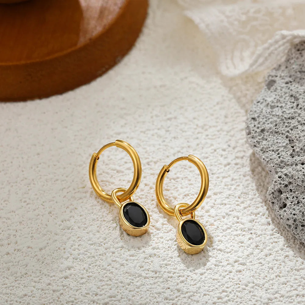 Women's retro simple oval zircon earrings in copper, showing the elliptical design on a model.