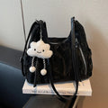 Women's fashion backpack in soft PU leather, shown in black, milky white, silver, and blue colour options with a pendant.
