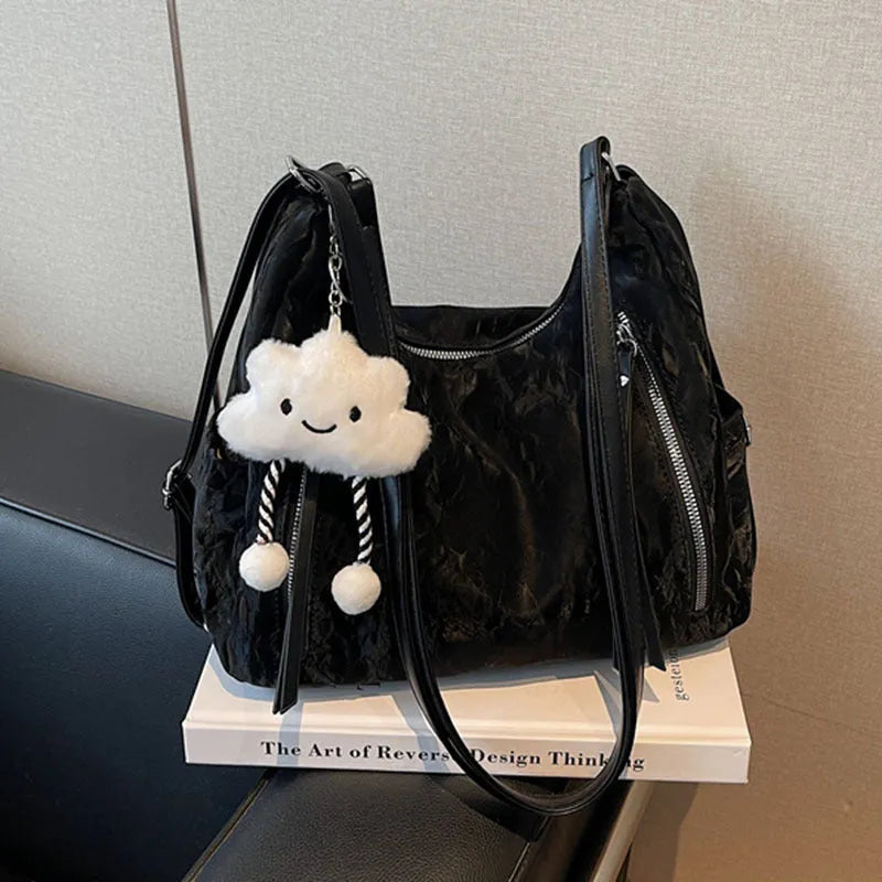 Women's fashion backpack in soft PU leather, shown in black, milky white, silver, and blue colour options with a pendant.