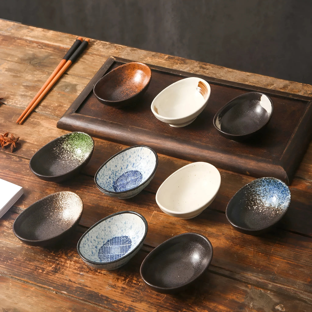 Japanese oval ceramic sauce dipping bowl with traditional underglaze pattern design
