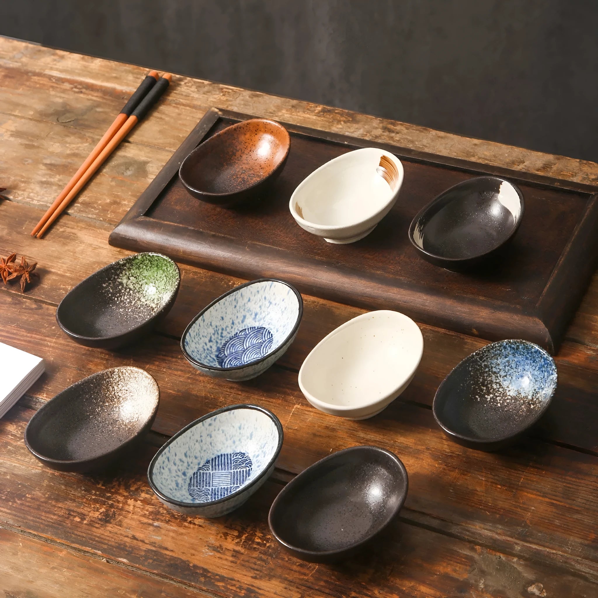 Japanese oval ceramic sauce dipping bowl with traditional underglaze pattern design