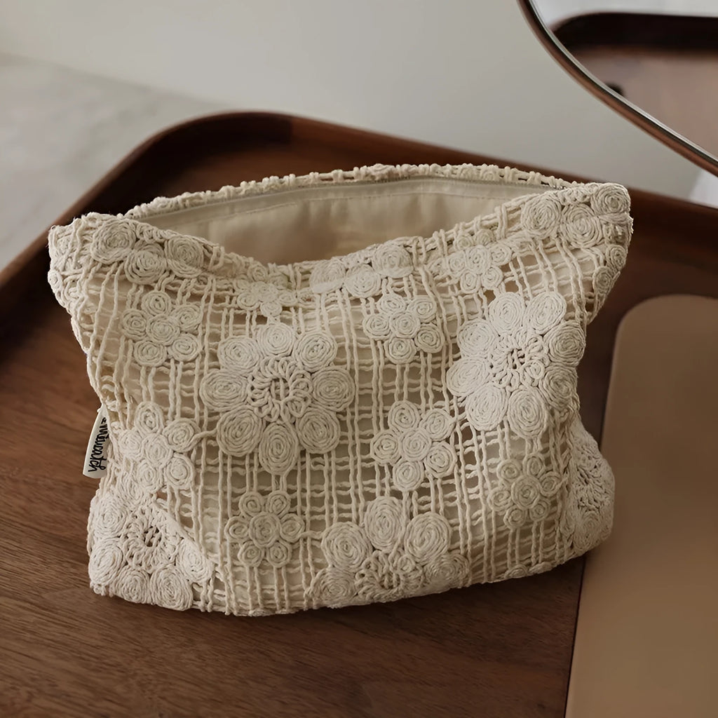 Handmade crocheted corduroy cosmetic bag with hollow flower pattern and ethnic embroidery details