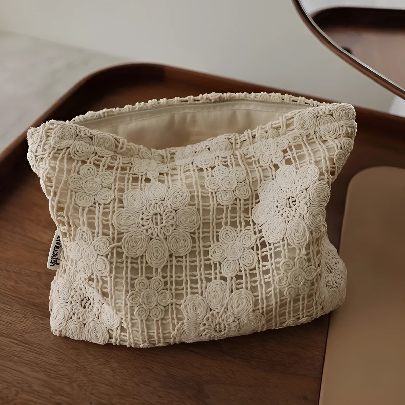 Handmade crocheted corduroy cosmetic bag with hollow flower pattern and ethnic embroidery details