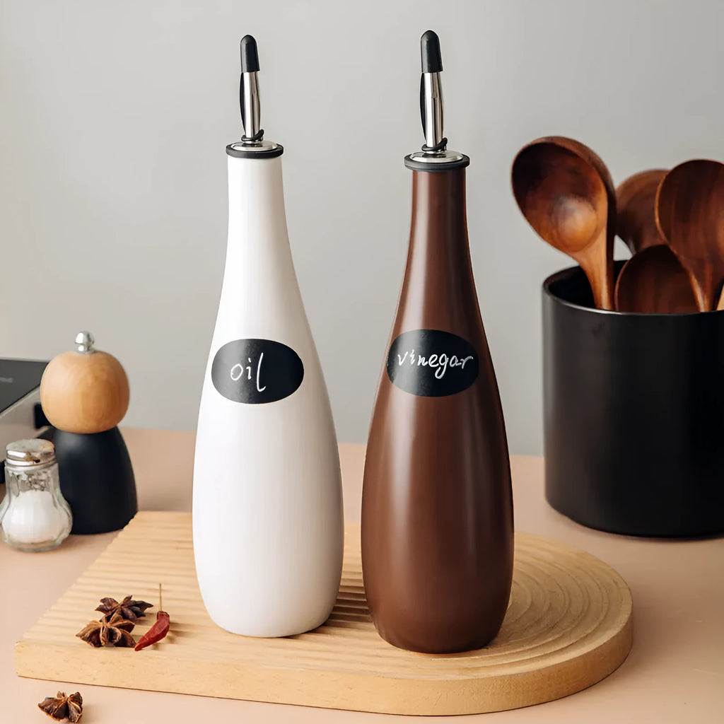 Ceramic oil pot with 650ml conical funnel and integrated pouring brush in black, coffee, or white finish