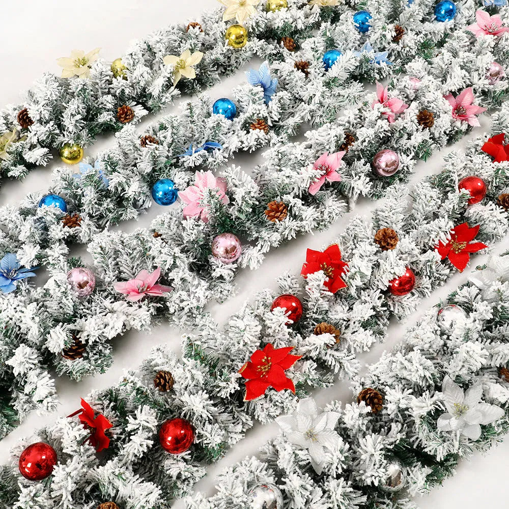 Flocked PVC rattan vine Christmas garland decoration in a festive colour, draped over a mantelpiece.