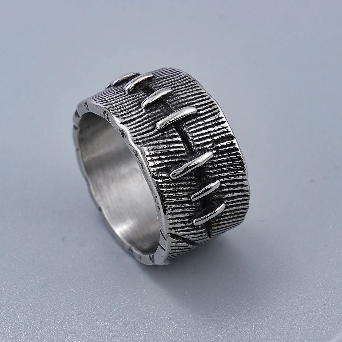 Geometric U-shaped titanium steel punk ring with double-ring construction in dark retro colour.