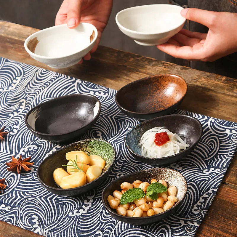 Japanese oval ceramic sauce dipping bowl with traditional underglaze pattern design