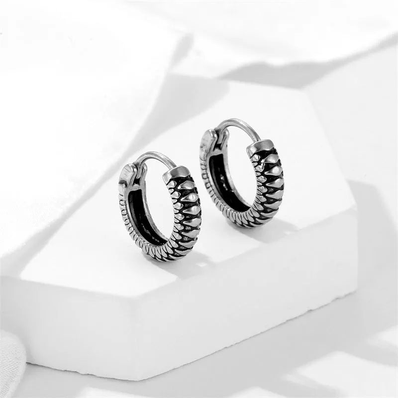 Round geometric retro twist earrings in titanium steel with stripe pattern, silver colour