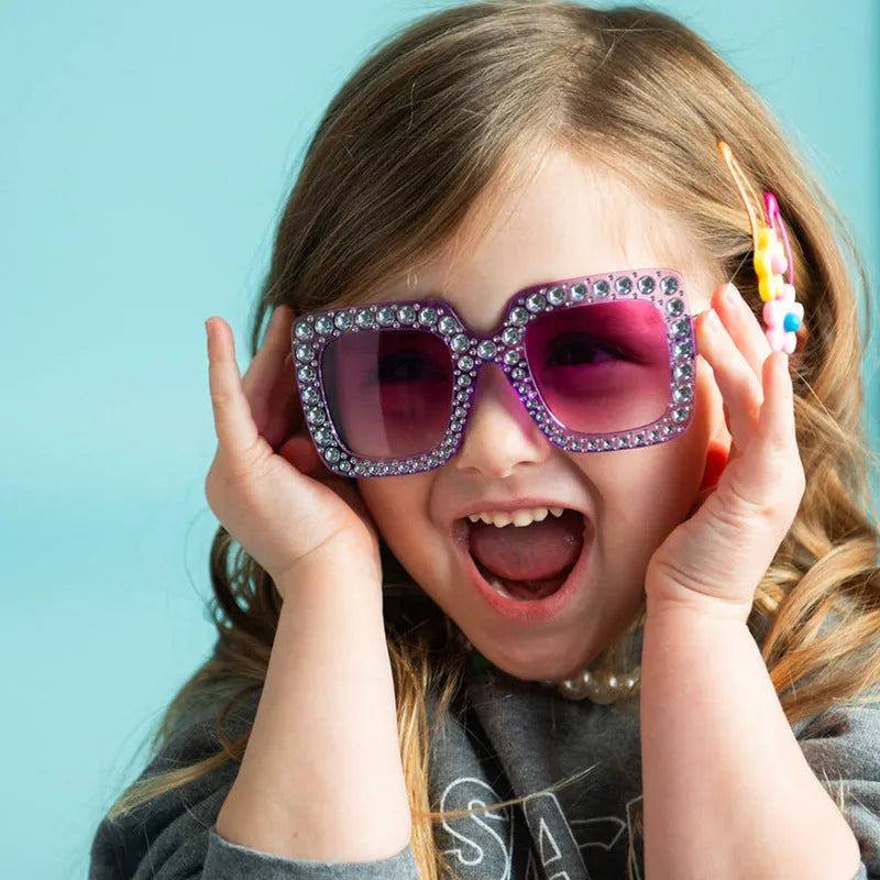 Plastic fashion sunglasses in various colour combinations including black frame gray lens and transparent tea frame brown lens options