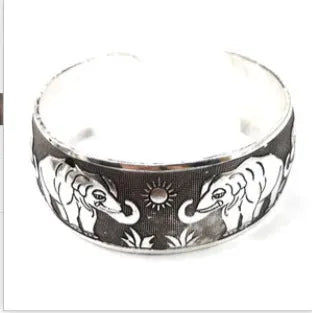 Carved open alloy bracelet with Miao ethnic design in elephant or turtle colour finish