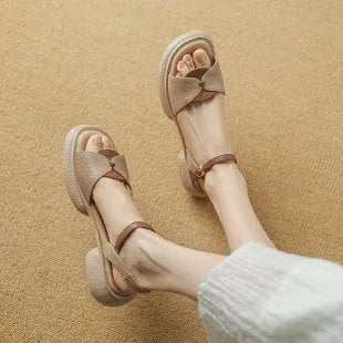 Women's khaki chunky heel platform sandals with open toe and renewable leather upper.