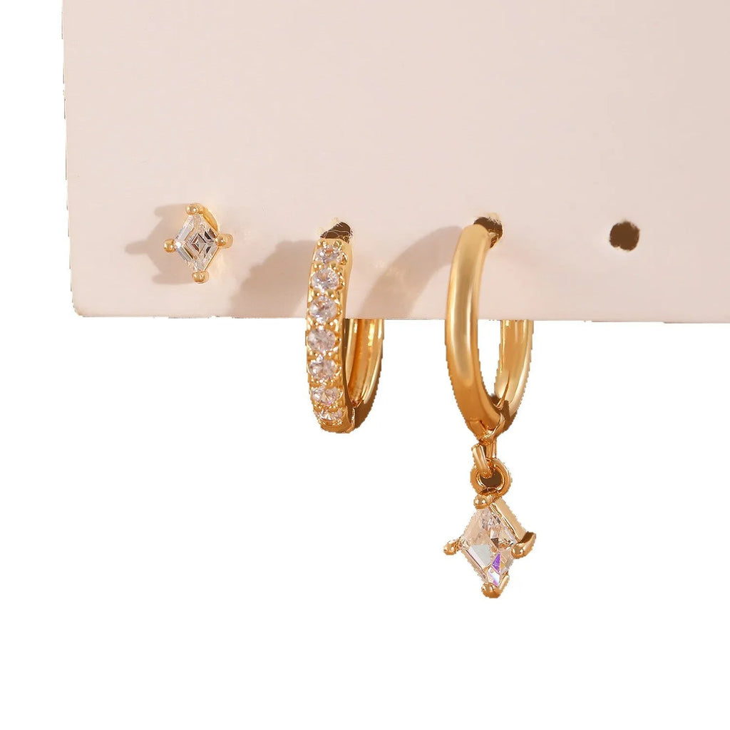 Ladies geometric jewellery set with zircon stones including pendant, ear clips, and stud earrings in gold or white