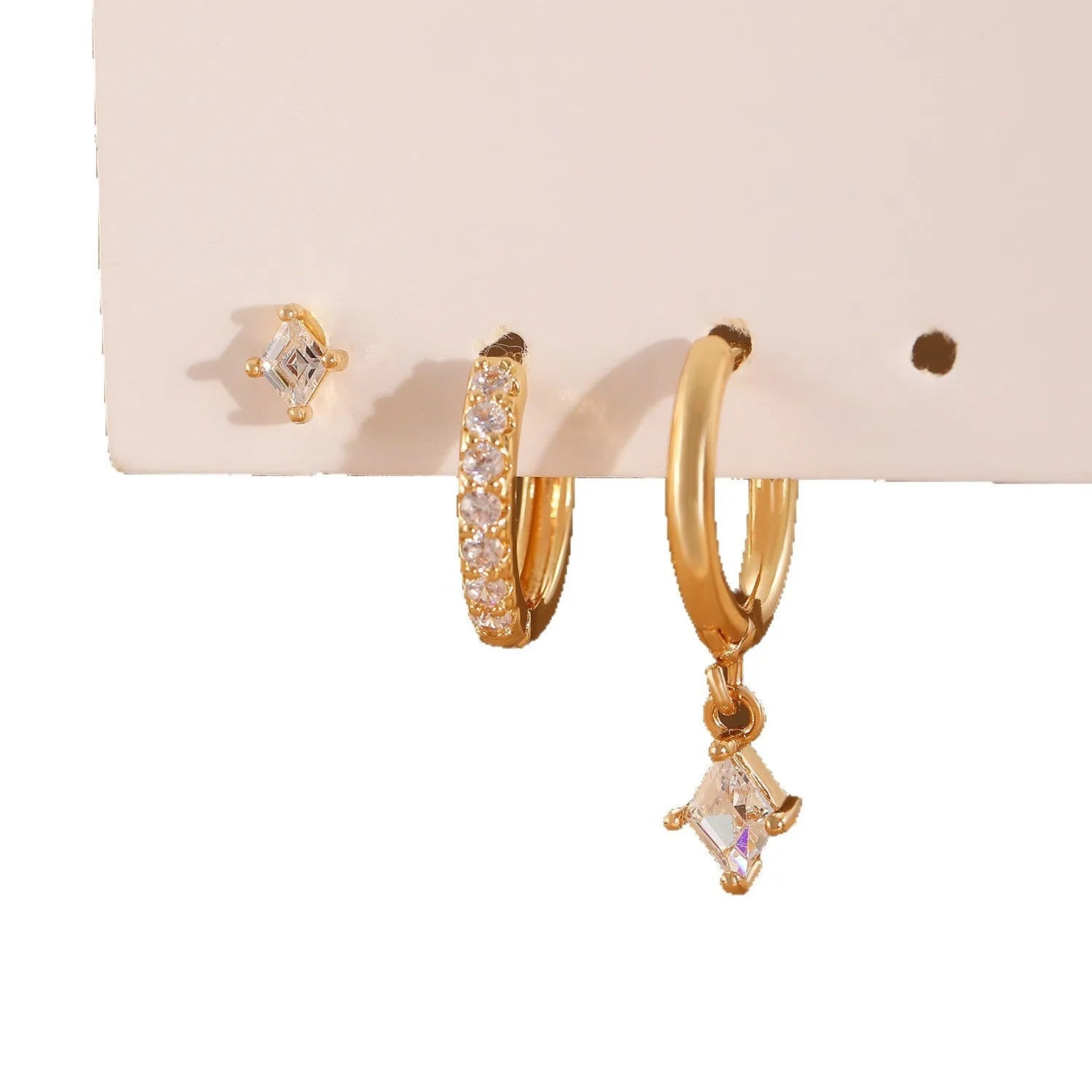 Ladies geometric jewellery set with zircon stones including pendant, ear clips, and stud earrings in gold or white