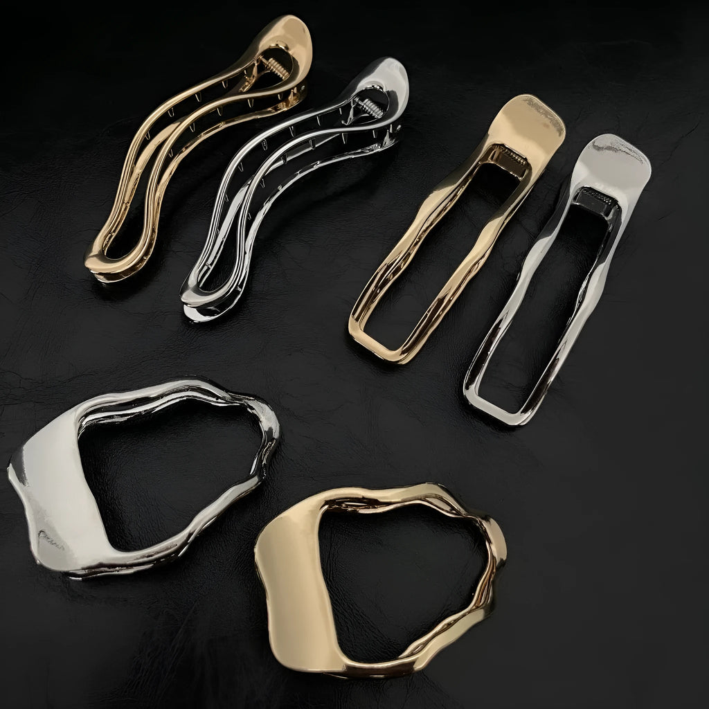 Women's zinc alloy hair barrette in gold and silver, showing square, arc and triangle shapes.