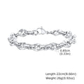 Handmade thick stainless steel geometric chain bracelet for men on a grey background.