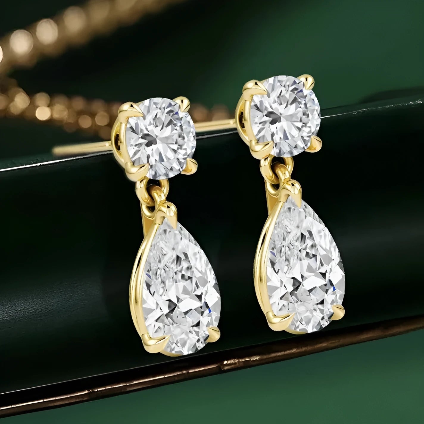 Sterling silver water drop moissanite stud earrings with geometric gold or silver plated design