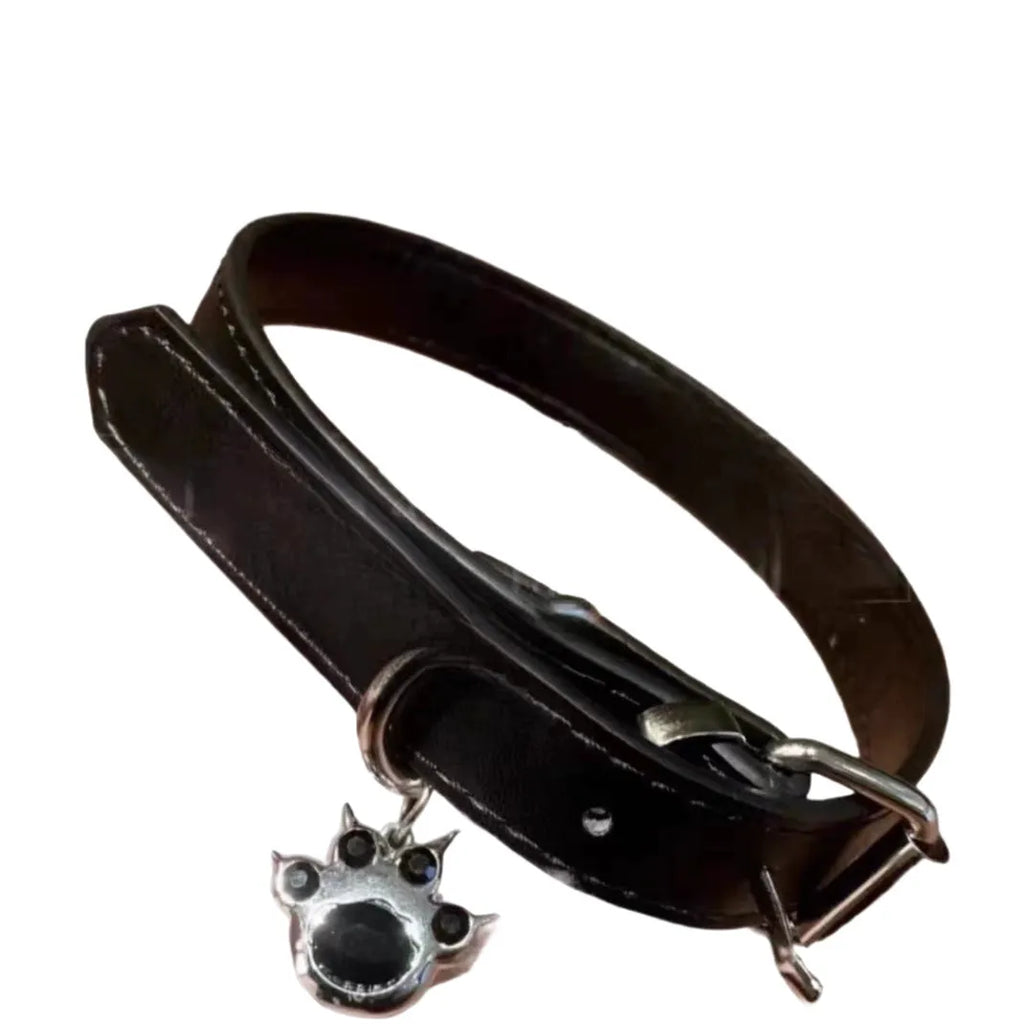 Black adjustable dog collar with a bell charm, shown in LD leather, cute bone, and cute cat paw designs.