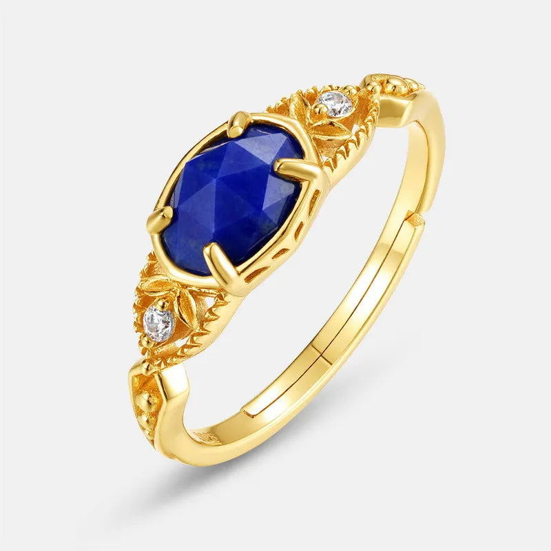 Japanese style geometric ellipse silver alloy ring for women in a lapis lazuli forest night sky colour.