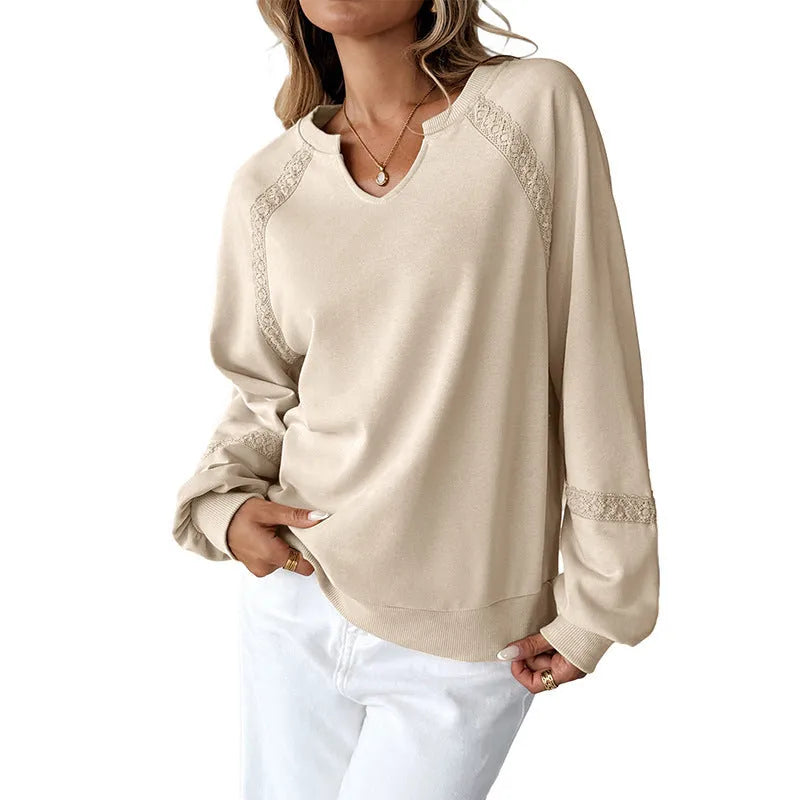 Women's loose long sleeve sweater in apricot with a half-open collar and lace stitching detail.