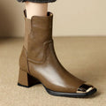 Women's brown and black slimming Martin ankle boots with side zipper and decorative metal details.