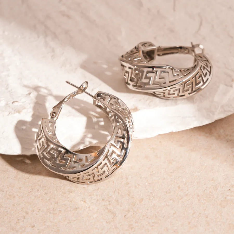 Geometric hollow stud earrings with twisted round design in silver needle-gold or silver needle-silver finish