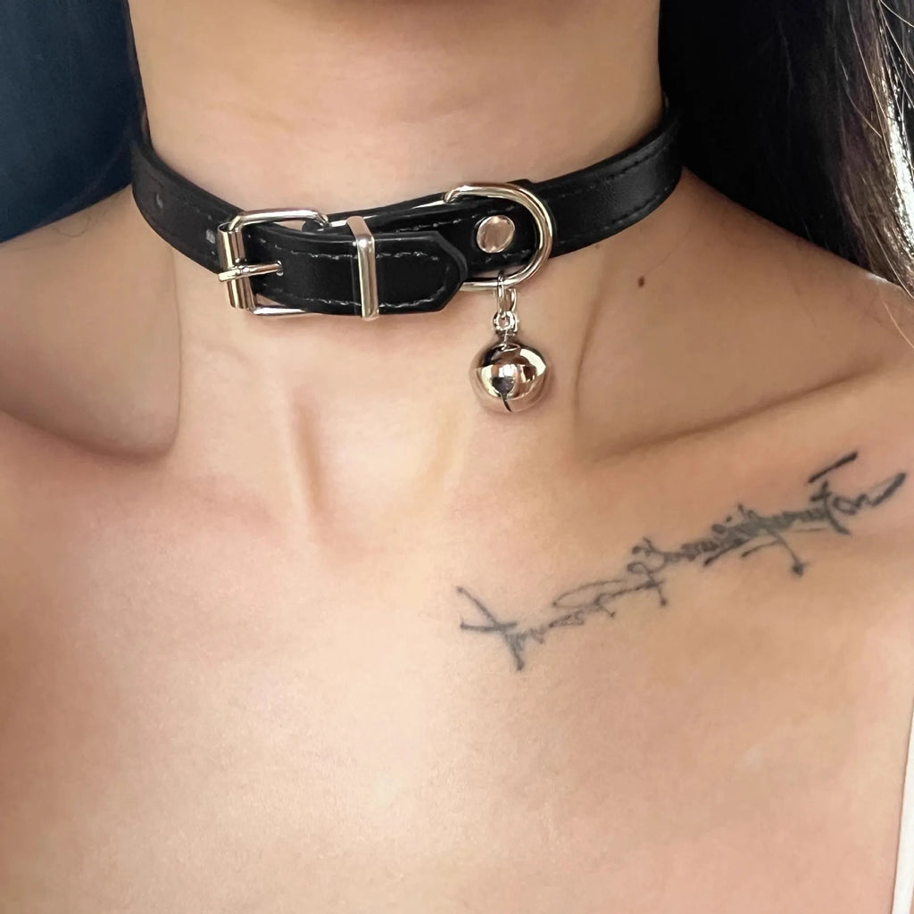Black adjustable dog collar with a bell charm, shown in LD leather, cute bone, and cute cat paw designs.