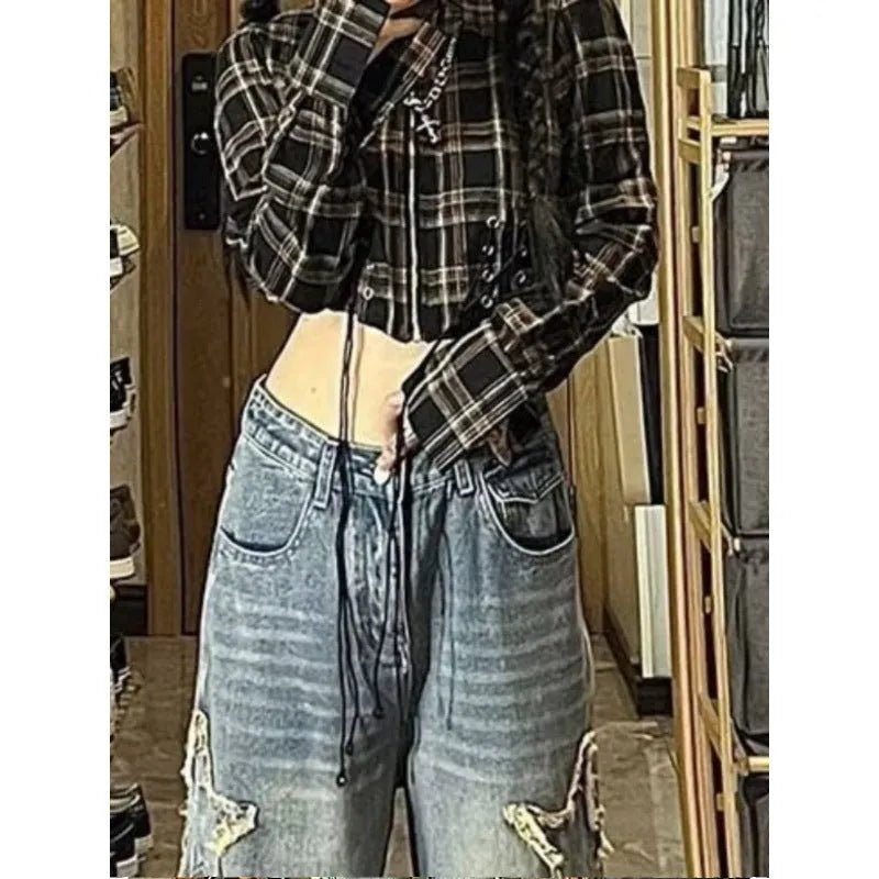 Blue women's high-waisted straight-leg jeans laid flat, showing the front design and medium wash denim texture.