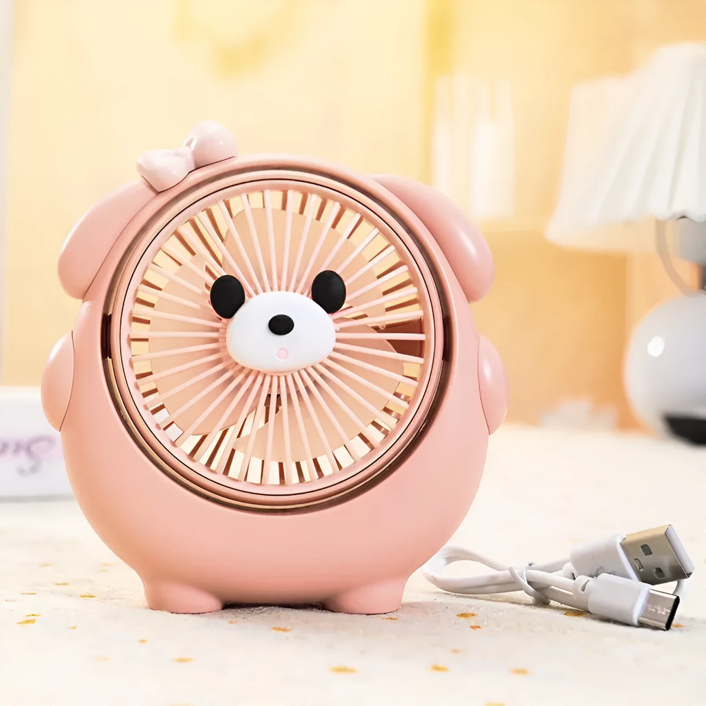 Cute puppy-themed USB desktop electric fan in various colours on a desk.