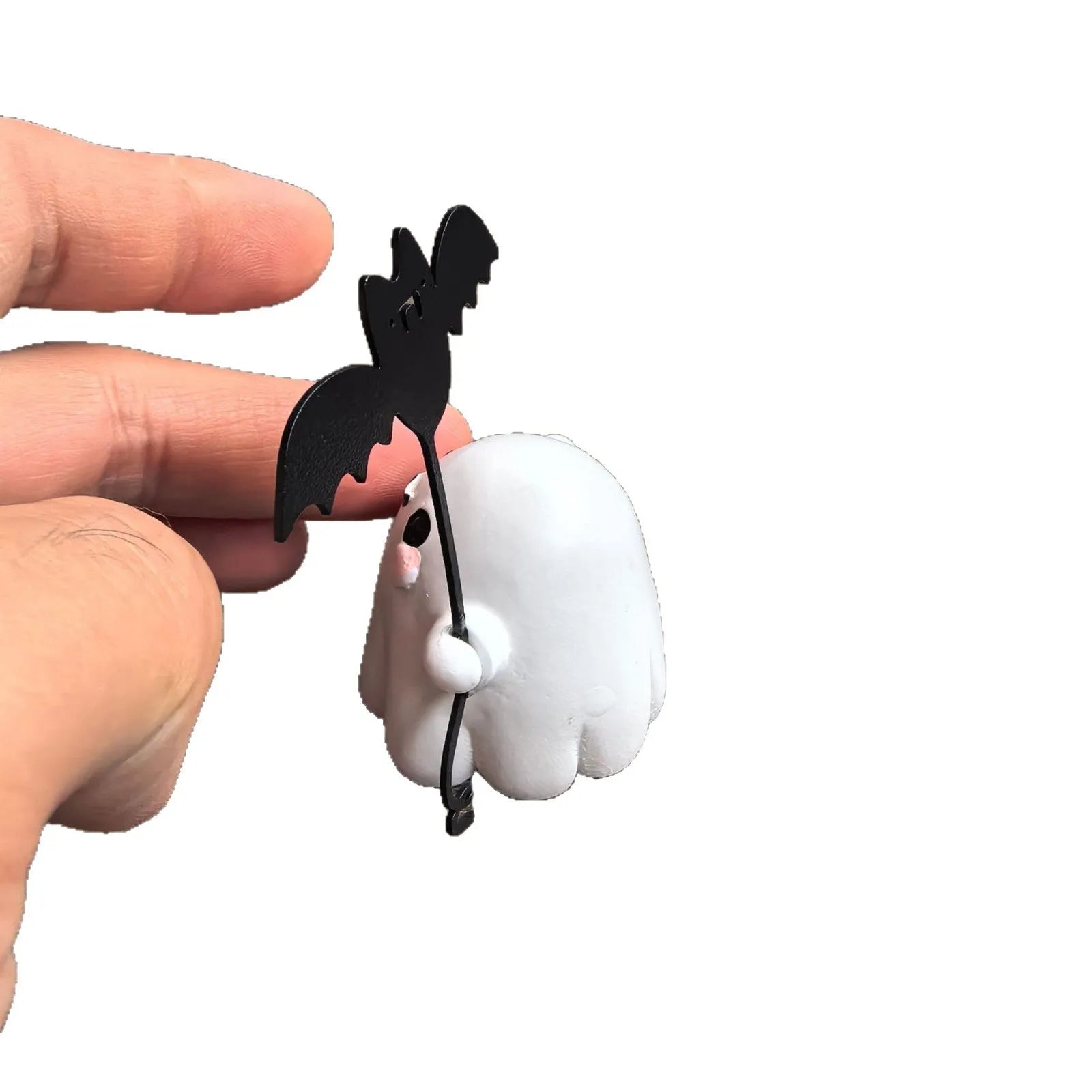 Mini resin figurine of a ghost walking a small dog, a 4x5x4cm Halloween decoration.