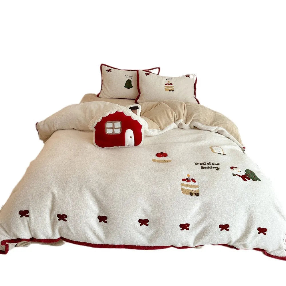 Snowman Milk Pastry cartoon print bedding four-piece set including sheet, duvet cover, and pillowcases on a bed.