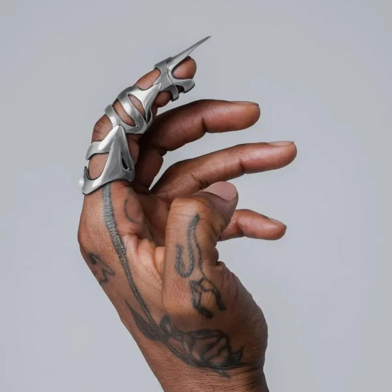 Polished silver alloy punk armour finger stall ring showing detailed sculpted metal design