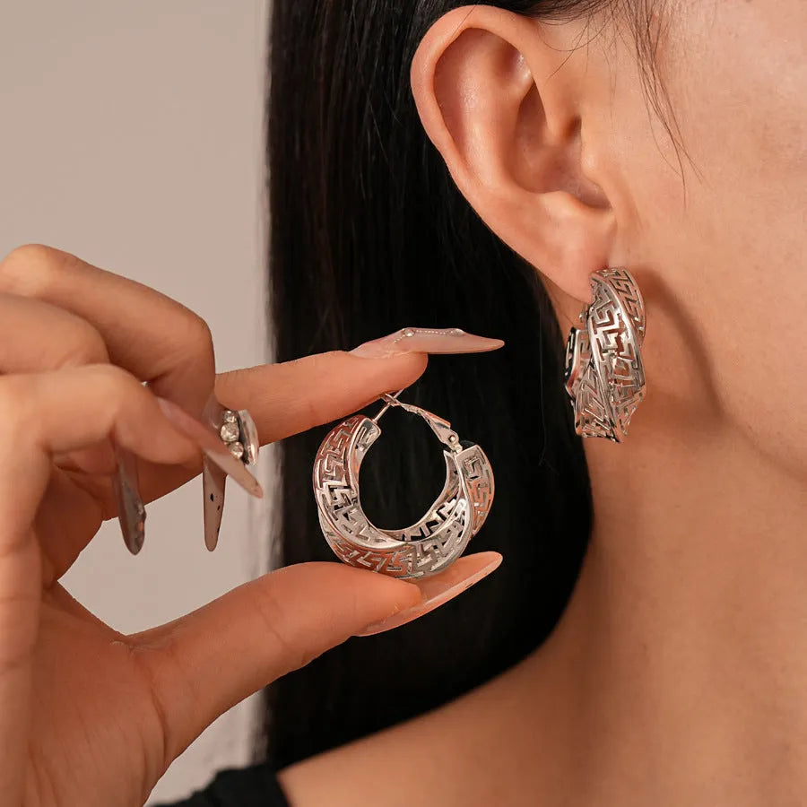 Geometric hollow stud earrings with twisted round design in silver needle-gold or silver needle-silver finish