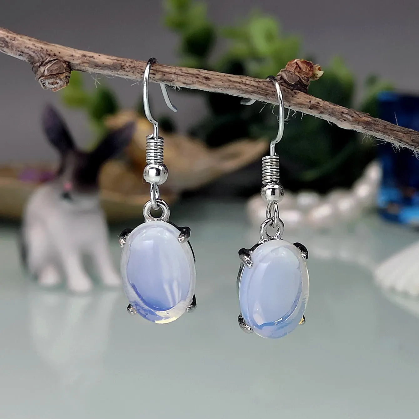 Moonlight white opal-inspired cross earrings with drop shape and electroplated alloy construction
