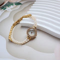 Women's light gold bracelet watch with freshwater pearls and round mineral glass dial