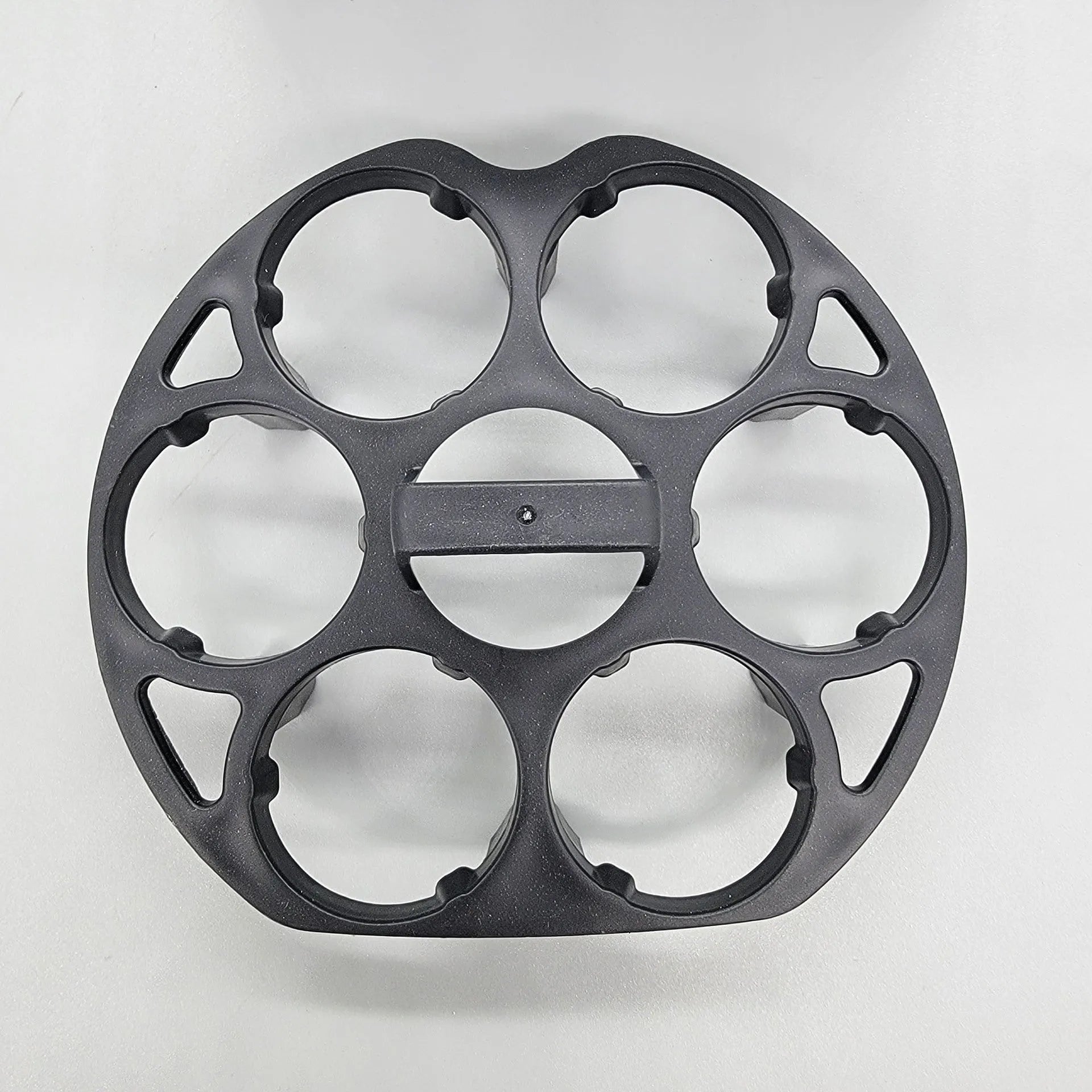 Black plastic egg holder basket measuring 13.8 by 12.6 by 5.7 centimetres