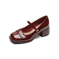 Women's patent leather chunky heel pumps with square toe and buckle fastening, shown in apricot colour.