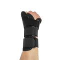 Black and grey carbon fibre sports wrist guard with thumb strap shown on a hand.