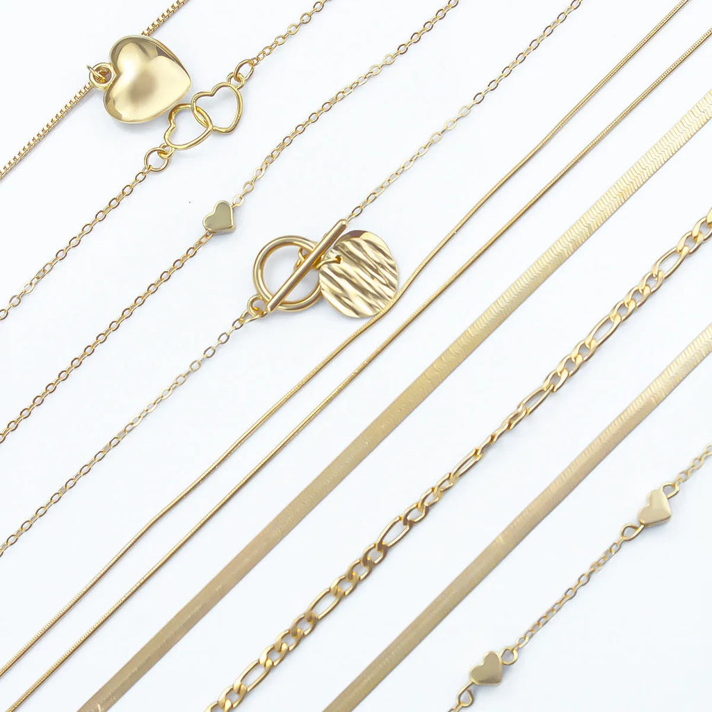 Set of 10 gold electroplated women's necklaces with snake bones chains and alloy pendants