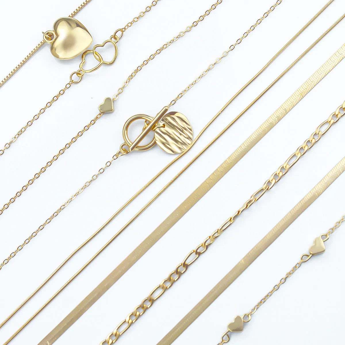 Set of 10 gold electroplated women's necklaces with snake bones chains and alloy pendants