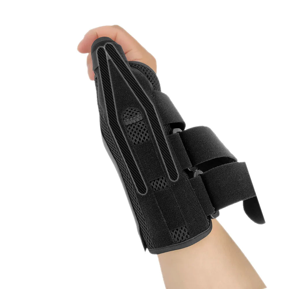 Black and grey carbon fibre sports wrist guard with thumb strap shown on a hand.