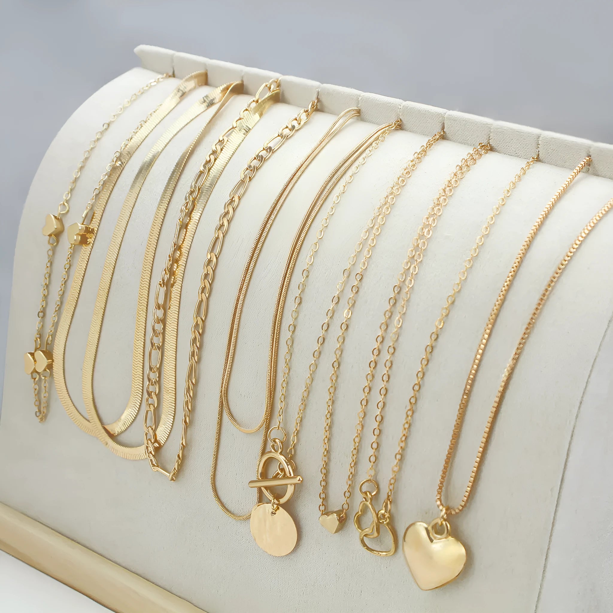 Set of 10 gold electroplated women's necklaces with snake bones chains and alloy pendants