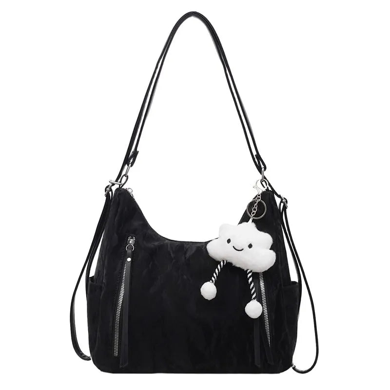 Women's fashion backpack in soft PU leather, shown in black, milky white, silver, and blue colour options with a pendant.
