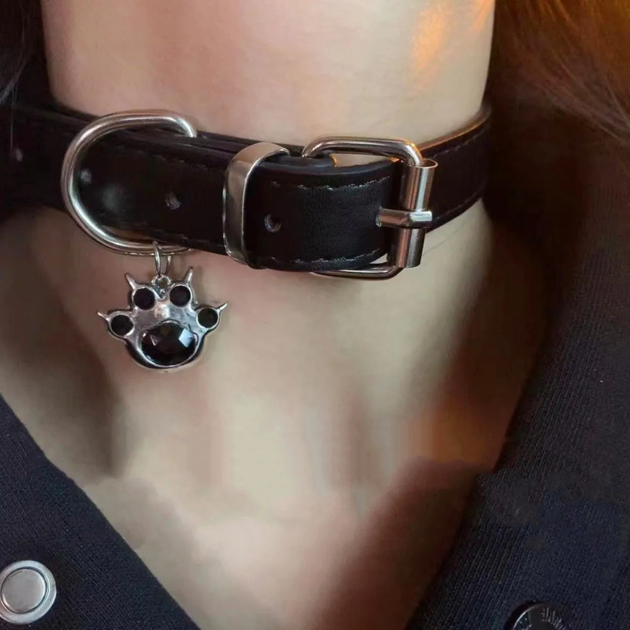Black adjustable dog collar with a bell charm, shown in LD leather, cute bone, and cute cat paw designs.
